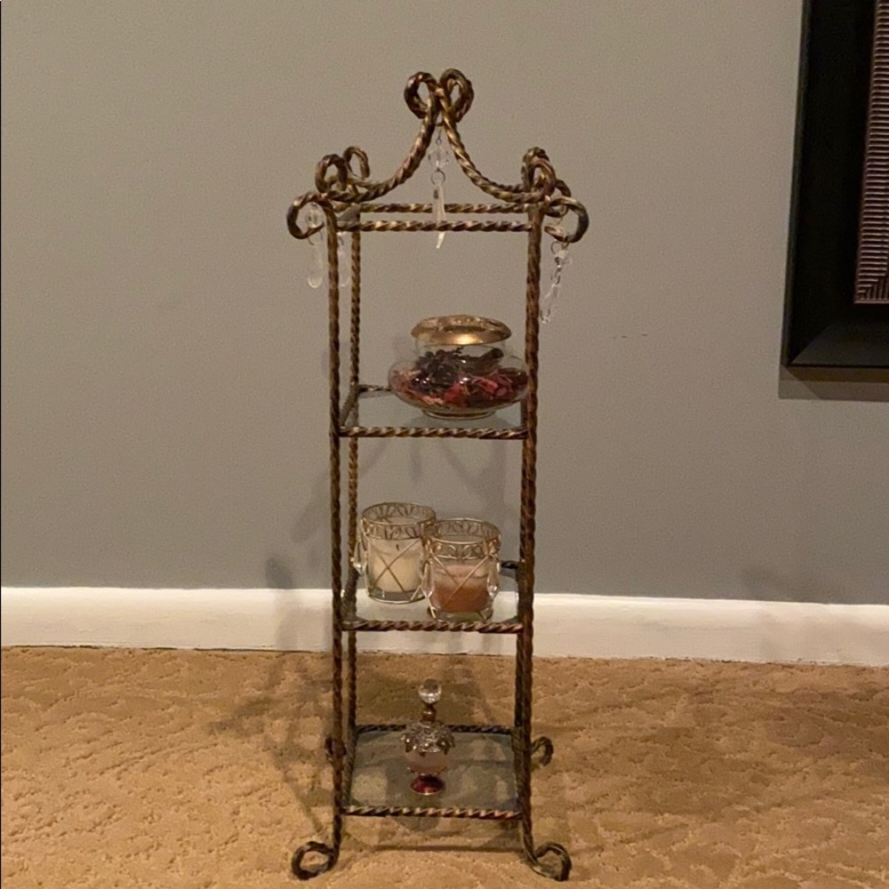 Beautiful burnished brass tabletop shelving unit.
